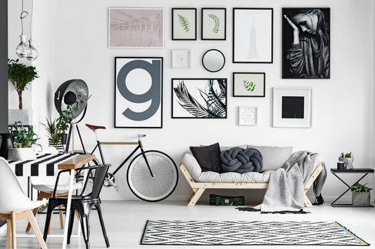 A cozy black and white lounge with modern art arrangement