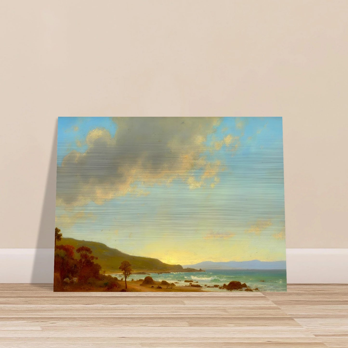 A sunlit coastal landscape with gentle waves meeting a golden shore, framed by rocky outcrops and distant hills under a vast sky.