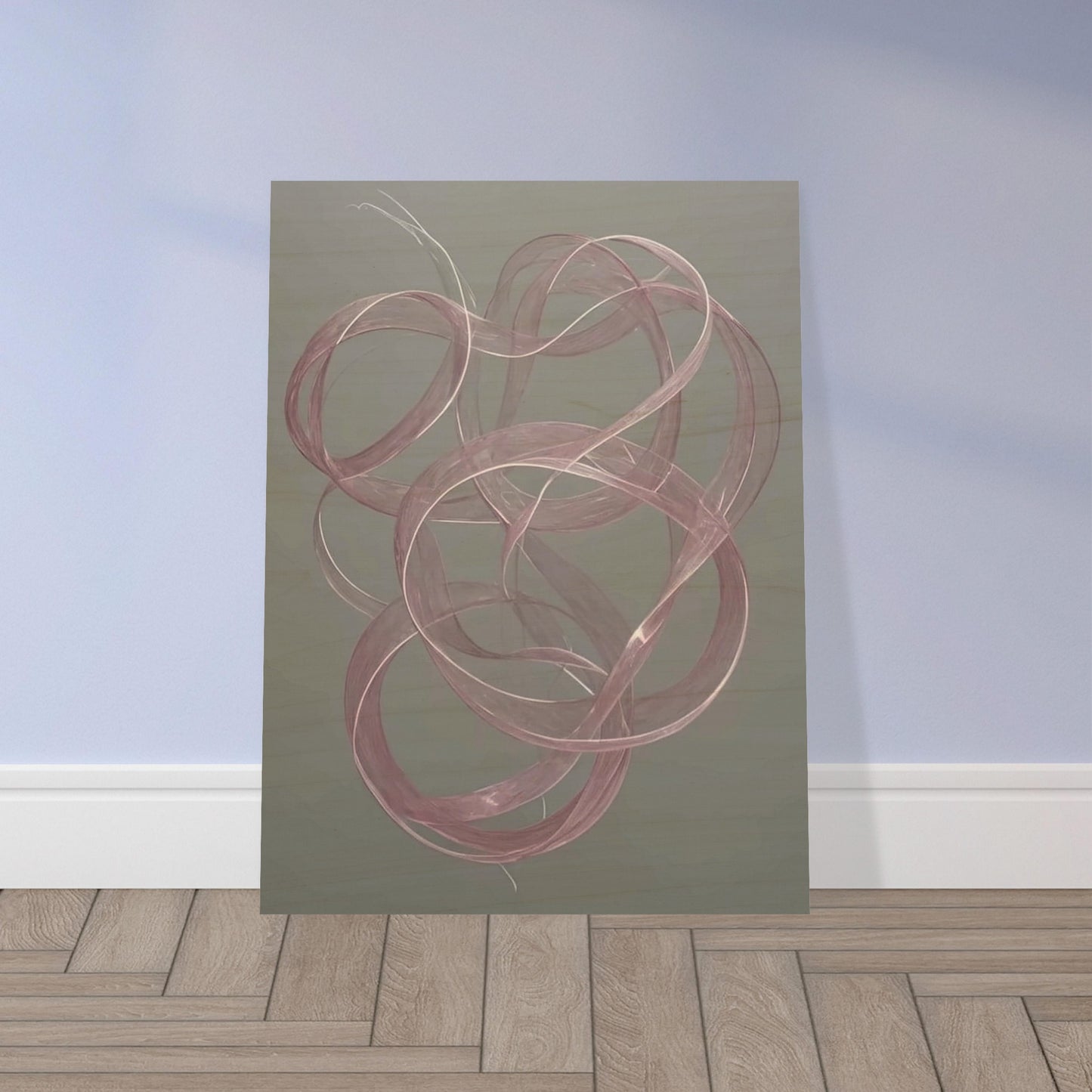 Delicate pink loops float gracefully against a muted gray background, creating a sense of movement and elegance in a tranquil space.