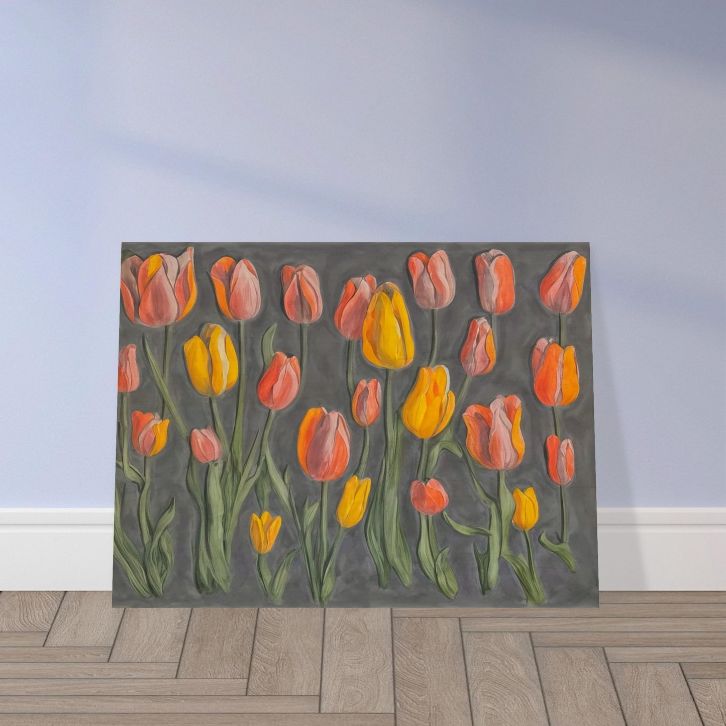 A charming display of orange and yellow tulips standing tall against a muted gray background, showcasing their vibrant colors and graceful stems.