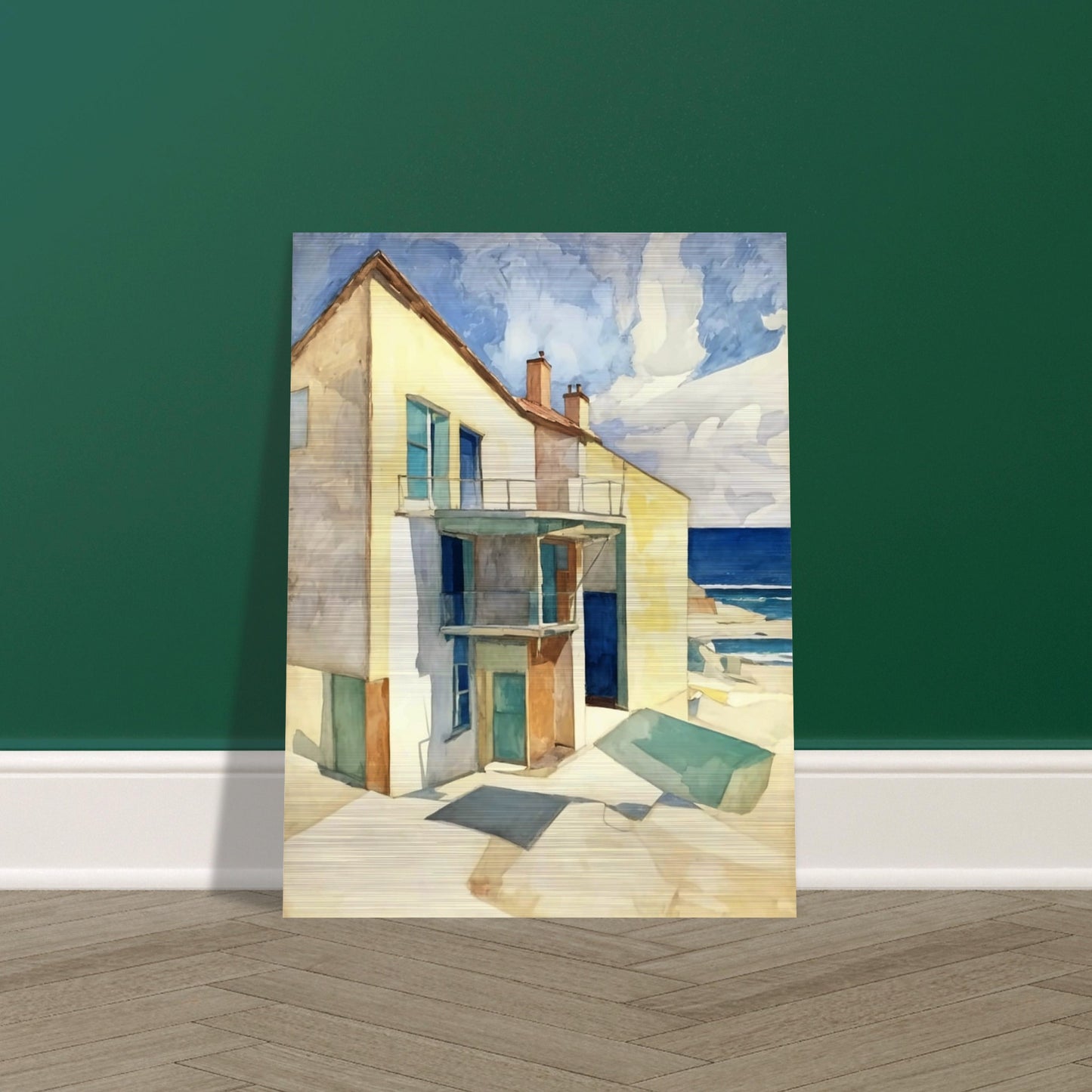 A bright seaside house casts long shadows under the afternoon sun, with a calm ocean and blue skies in the background.