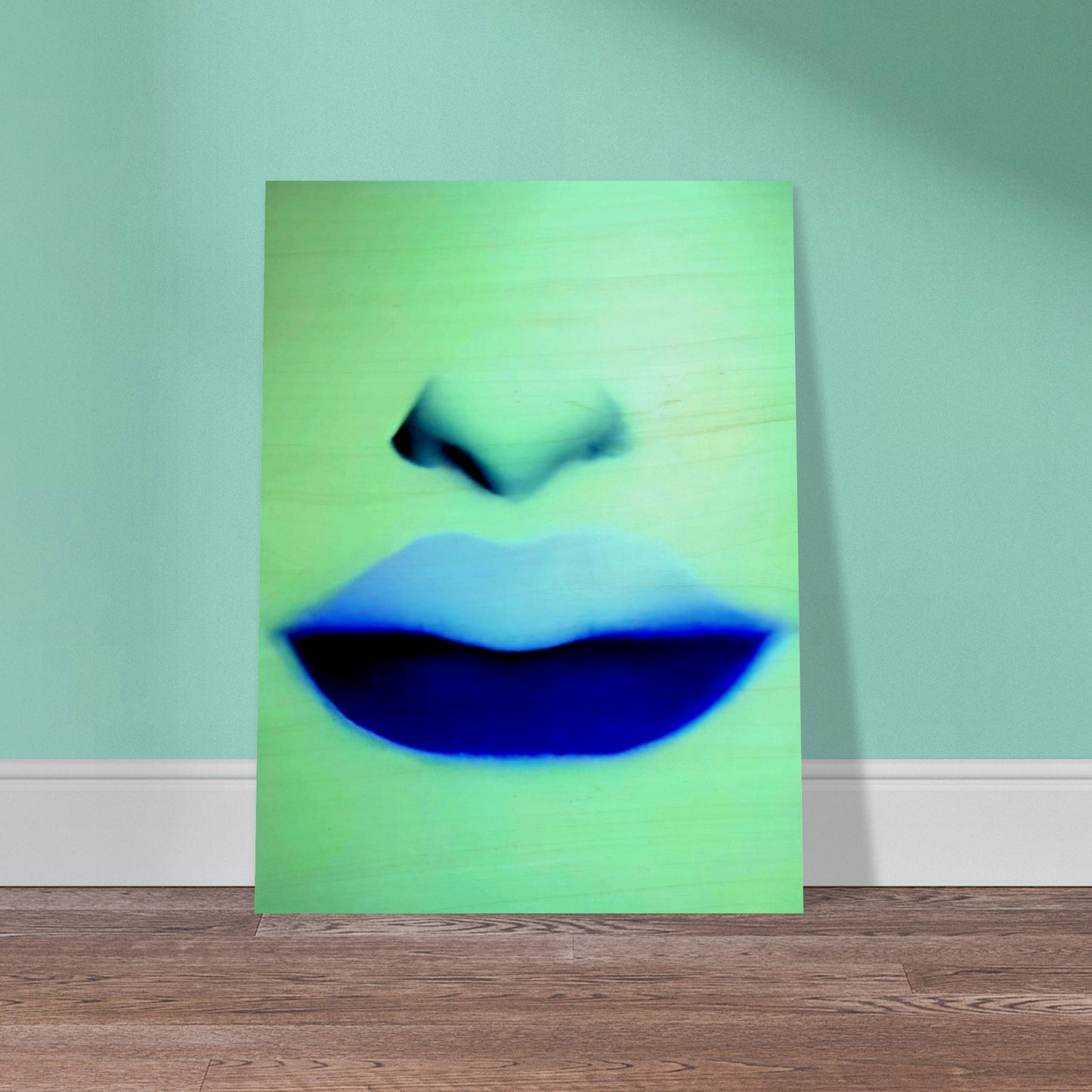 A close-up of soft lips and nose rendered in cool blue and green hues, creating a mysterious and ethereal vibe with bold contrast.