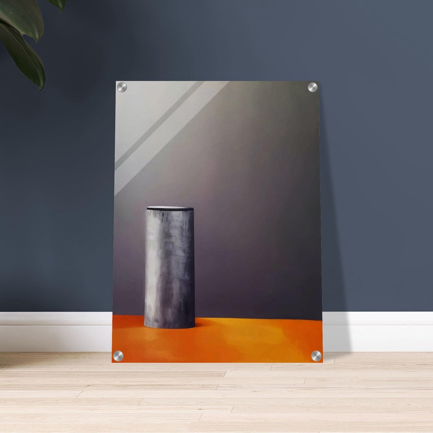 A minimalistic composition featuring a single cylindrical gray object standing on a warm orange surface against a dark, muted background, evoking stillness and simplicity.