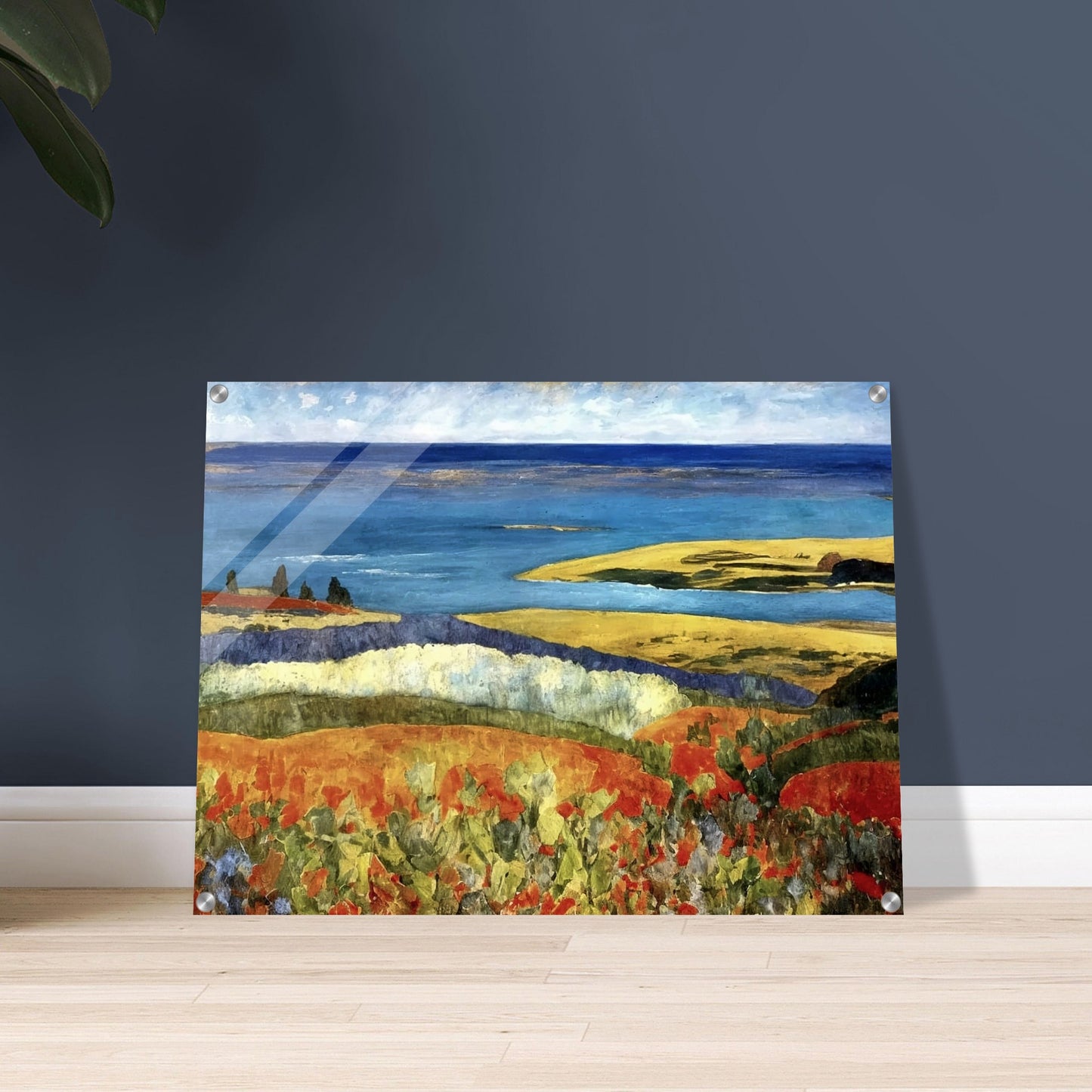 A vivid coastal landscape featuring rolling hills of red and green leading to a calm blue sea. A bright sky hovers over the serene shoreline.
