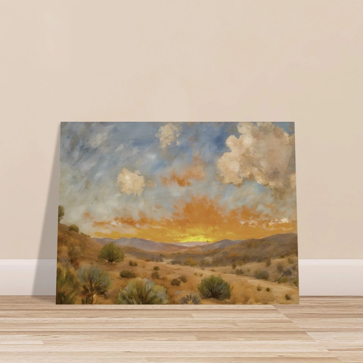 A glowing orange sunset spreads over a tranquil desert valley with scrubby bushes, rolling hills, and dramatic cloud cover.