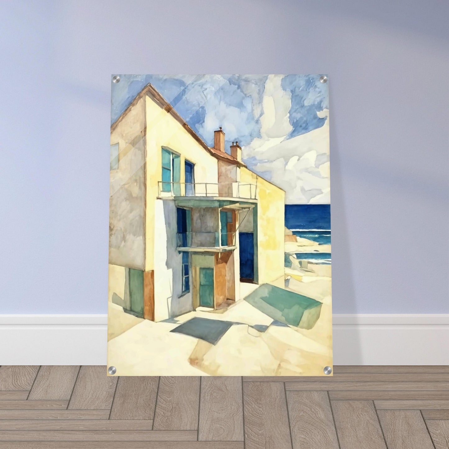 A bright seaside house casts long shadows under the afternoon sun, with a calm ocean and blue skies in the background.