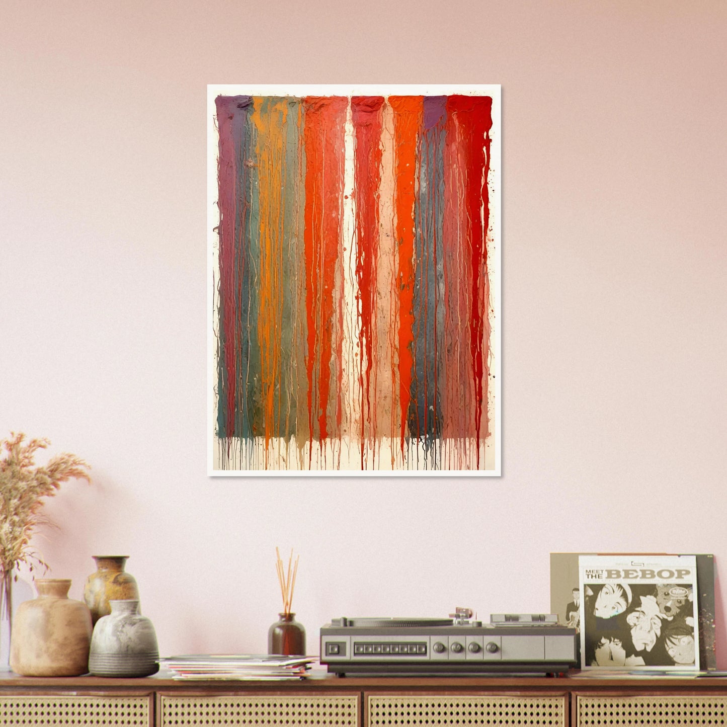 Vertical ribbons of vibrant paint drip down the canvas in layered red, orange, blue, and purple tones against a pale backdrop.