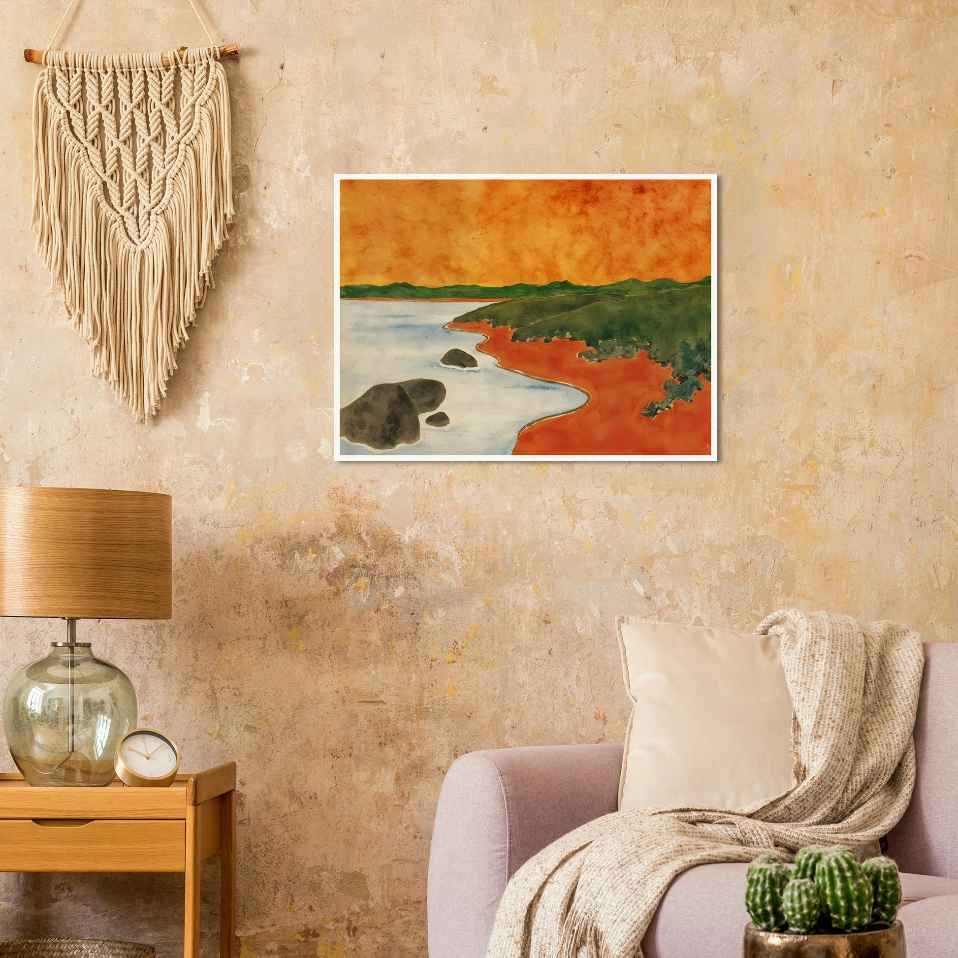 A vivid coastal scene with fiery orange skies, green hills, and calm shoreline waters meeting a winding red shoreline.