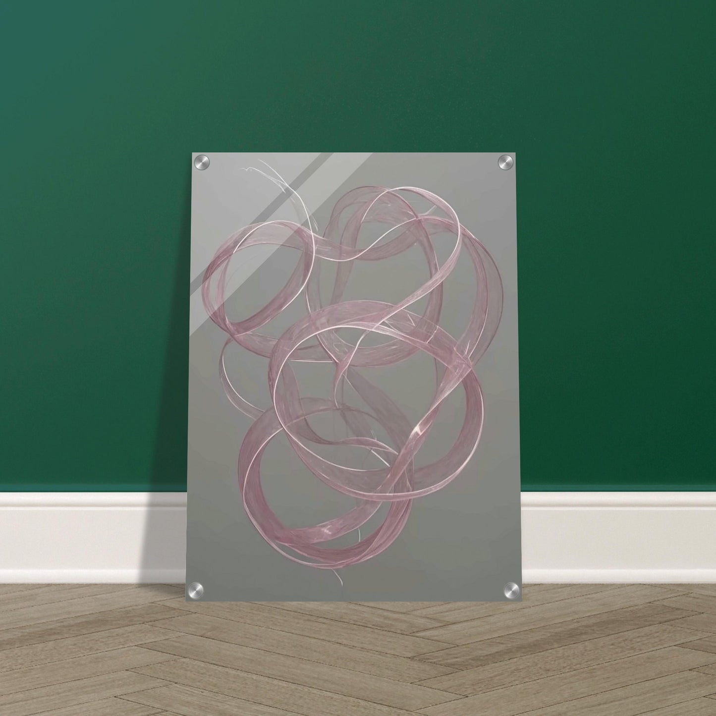 Delicate pink loops float gracefully against a muted gray background, creating a sense of movement and elegance in a tranquil space.