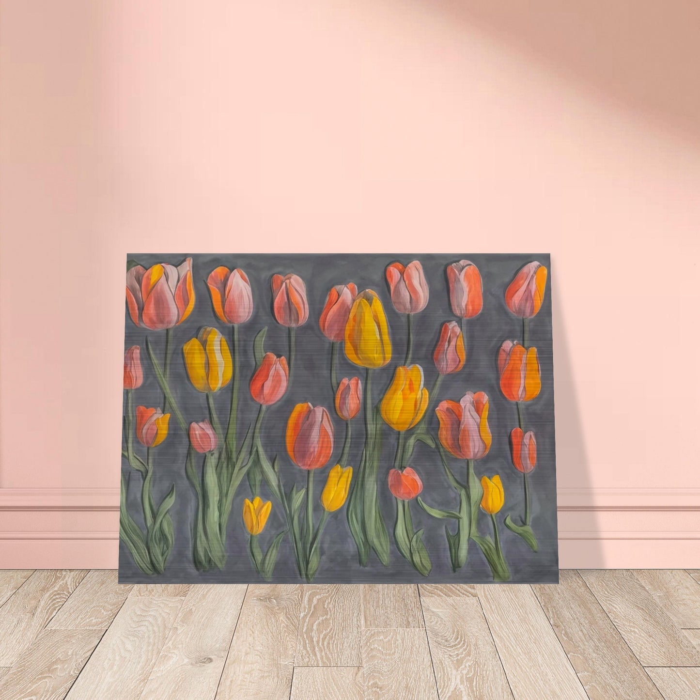 A charming display of orange and yellow tulips standing tall against a muted gray background, showcasing their vibrant colors and graceful stems.