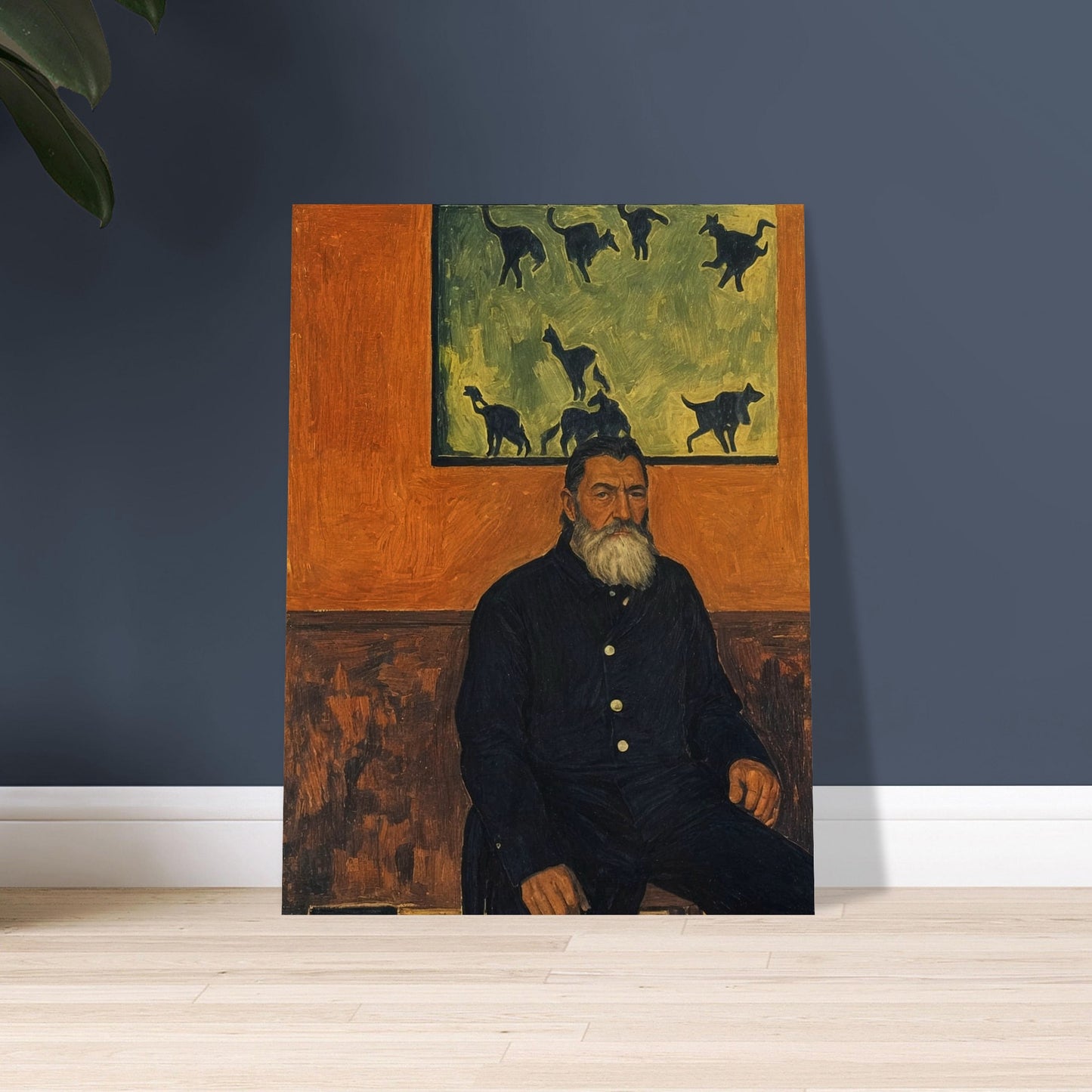 A bearded man seated against a burnt orange wall, gazing into the distance with a painting of cats behind him, exuding a quiet, contemplative presence.