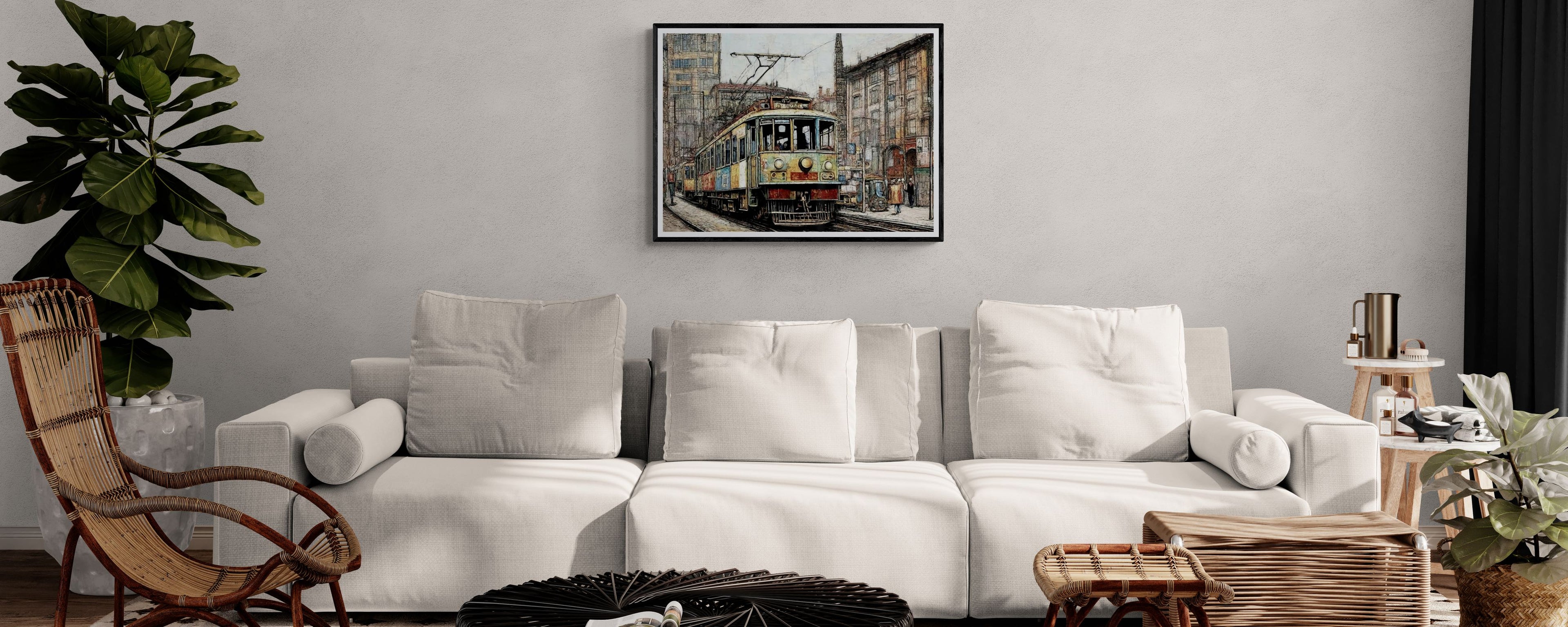 Cozy living room with a white sofa, wicker chair, and a framed vintage transportation wall art featuring a tram in an urban setting.