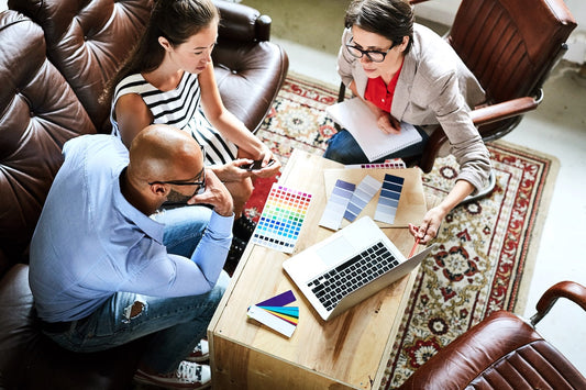 A couple consulting with the designer on top home decor trends