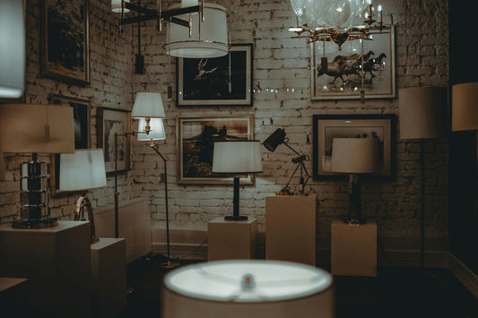 A photo of a gallery wall with different art works. 