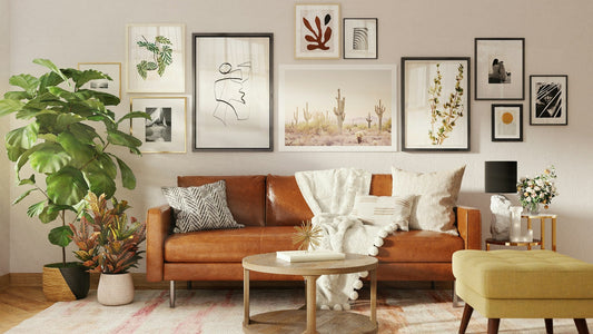 A beautifully arranged art gallery in a well-lit living room with a leather couch.