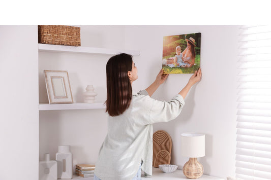 A woman placing a Mother’s Day art on the wall