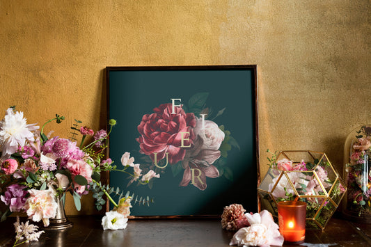 Framed floral print with fresh flowers and candle decor.
