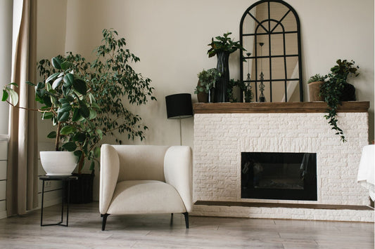 Potted plants play a key role in how to decorate a mantel for spring.