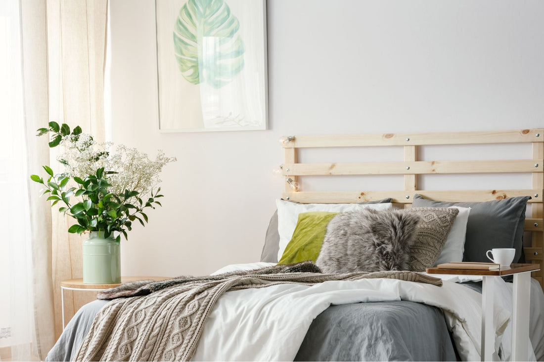 a cozy bedroom with fresh flowers as highlights on how to declutter and redecorate your bedroom in spring.