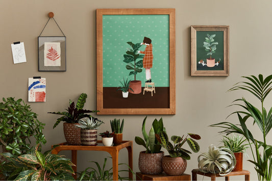 a garden-inspired interior with botanical art and house plants