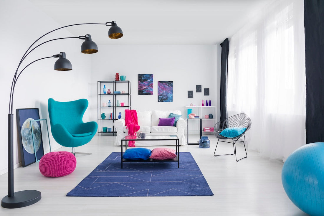 Table on blue carpet in white living room eccentric interior design