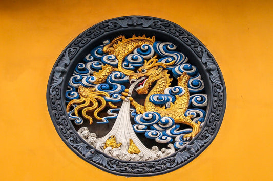 A wooden panel decor of a golden dragon