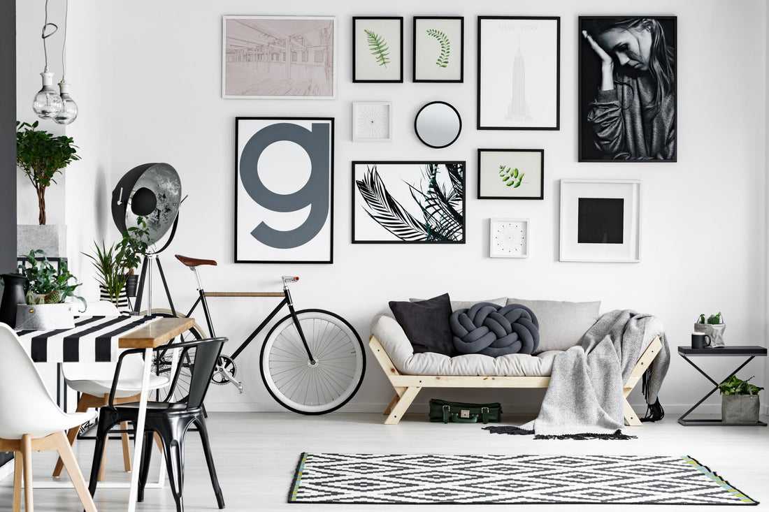 A cozy black and white lounge with modern art arrangement