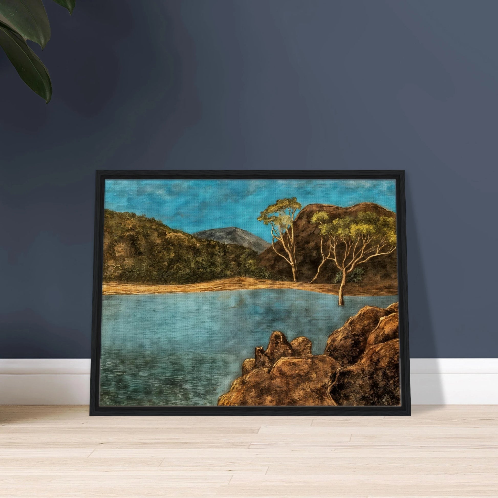 Blue lake with rocky shore, brown hills, slender trees, and turquoise sky in a quiet landscape.