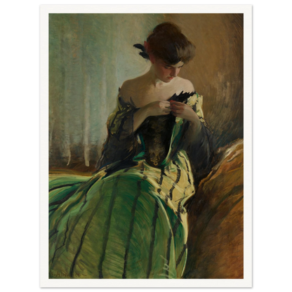Woman in green and black evening gown pins a detail at her neckline against a muted background