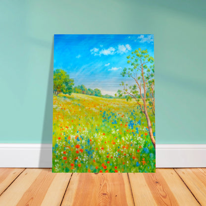Bright wildflower meadow under clear blue sky with delicate trees, colorful blossoms, and sunlit greenery stretching across a serene spring landscape.