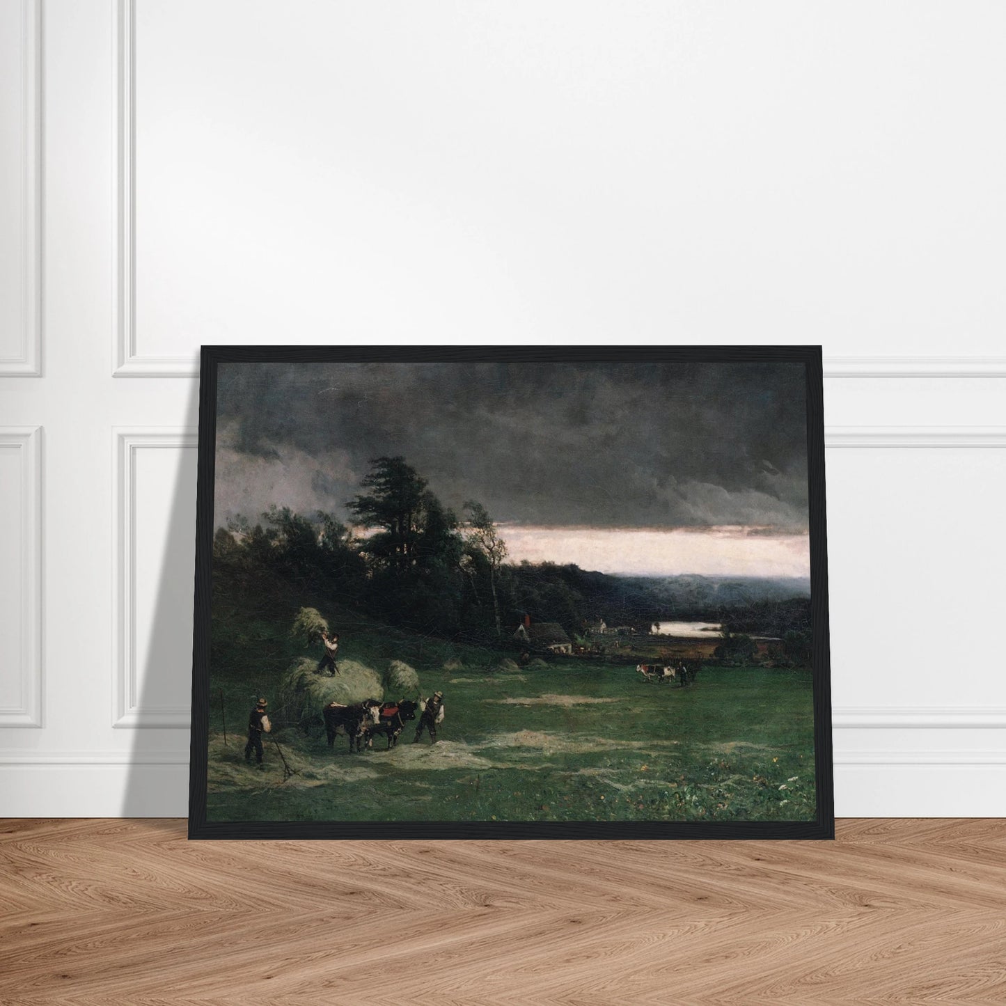 Workers gather hay in a green field under dark storm clouds