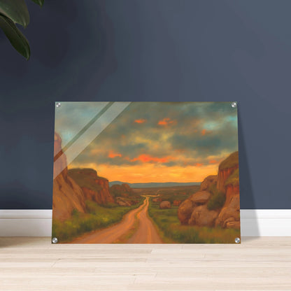 A winding dirt road cuts through rocky hills under a glowing sunset sky, evoking peace, wanderlust, and quiet reflection.