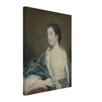Young woman in a blue robe with fur trim poses against a dark green background