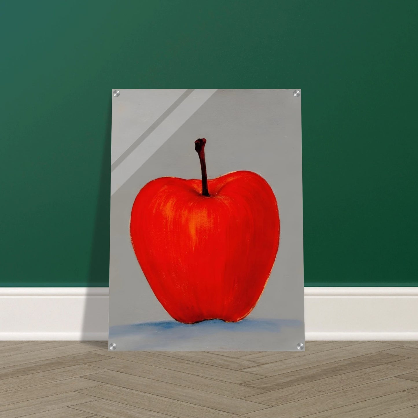 A vivid red apple stands alone against a muted gray backdrop, its glowing form balancing simplicity, boldness, and quiet elegance.