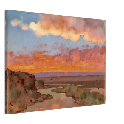 Soft desert river winding beneath glowing orange and pink sunset clouds, with distant plains and muted cliffs in a serene landscape.