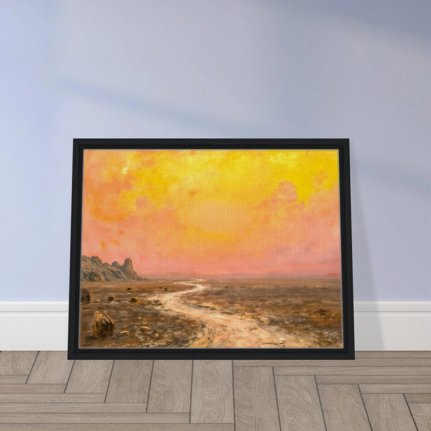A vast desert plain beneath glowing yellow and pink skies, with a winding pale path leading toward distant rocky formations.