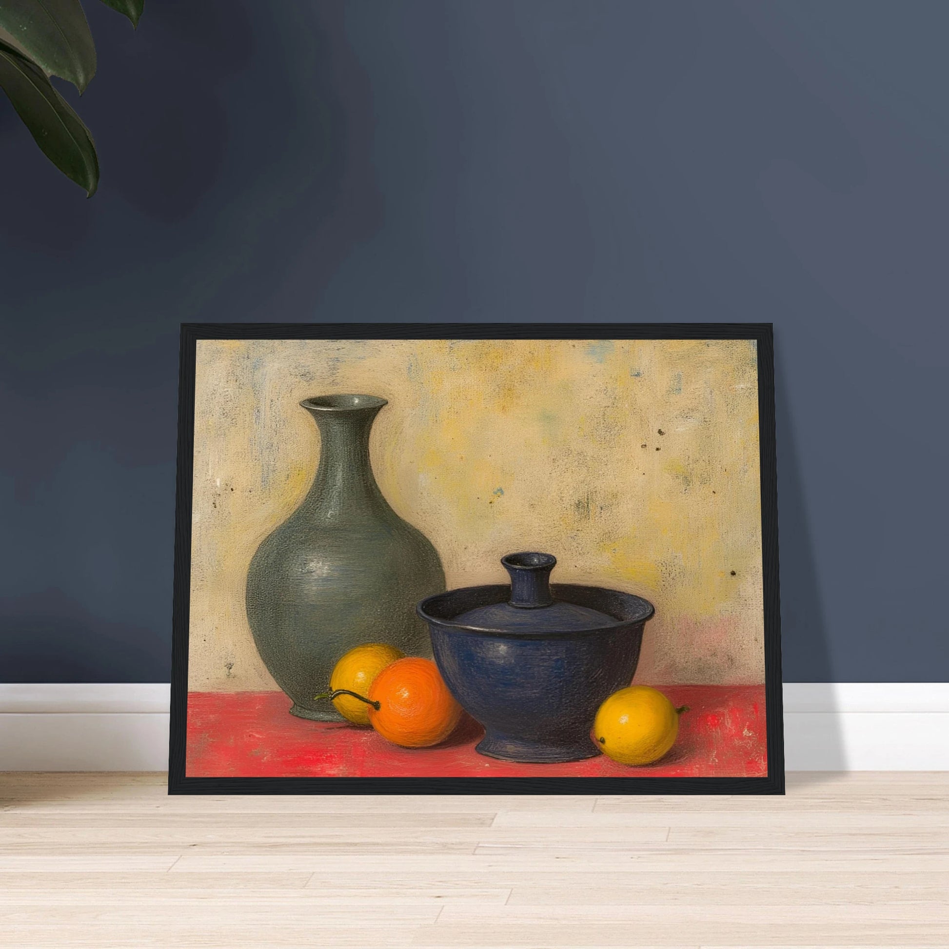 Blue and green ceramic vessels rest on a red surface beside lemons and an orange, against a softly textured neutral wall.