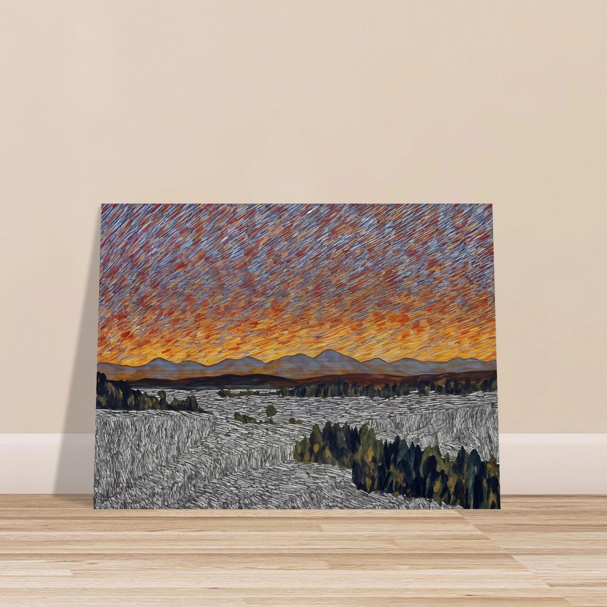 Vibrant orange sunset over distant mountains with textured sky and patterned fields in the foreground.