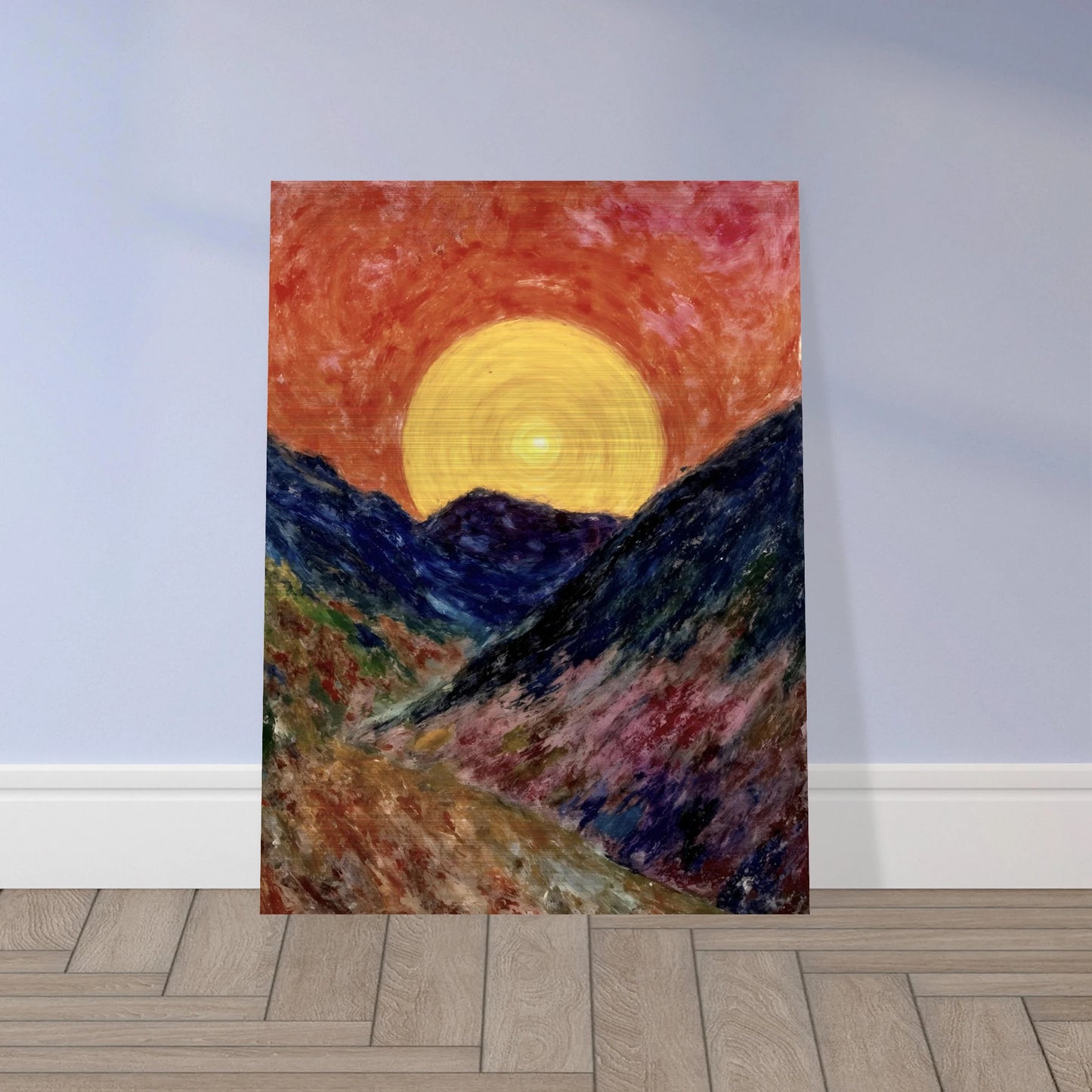 A vivid sunset over deep blue mountains with a glowing golden sun radiating warmth across the textured, colorful valley.
