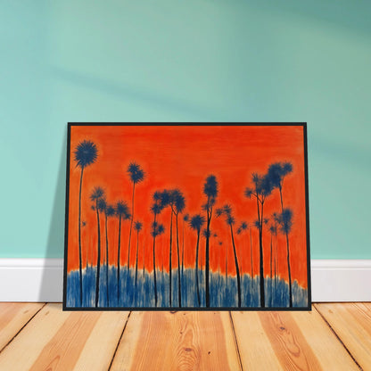 Dark silhouettes of tall palm-like trees rise against a vivid orange-red sky with deep blue ground tones, radiating intense warmth.
