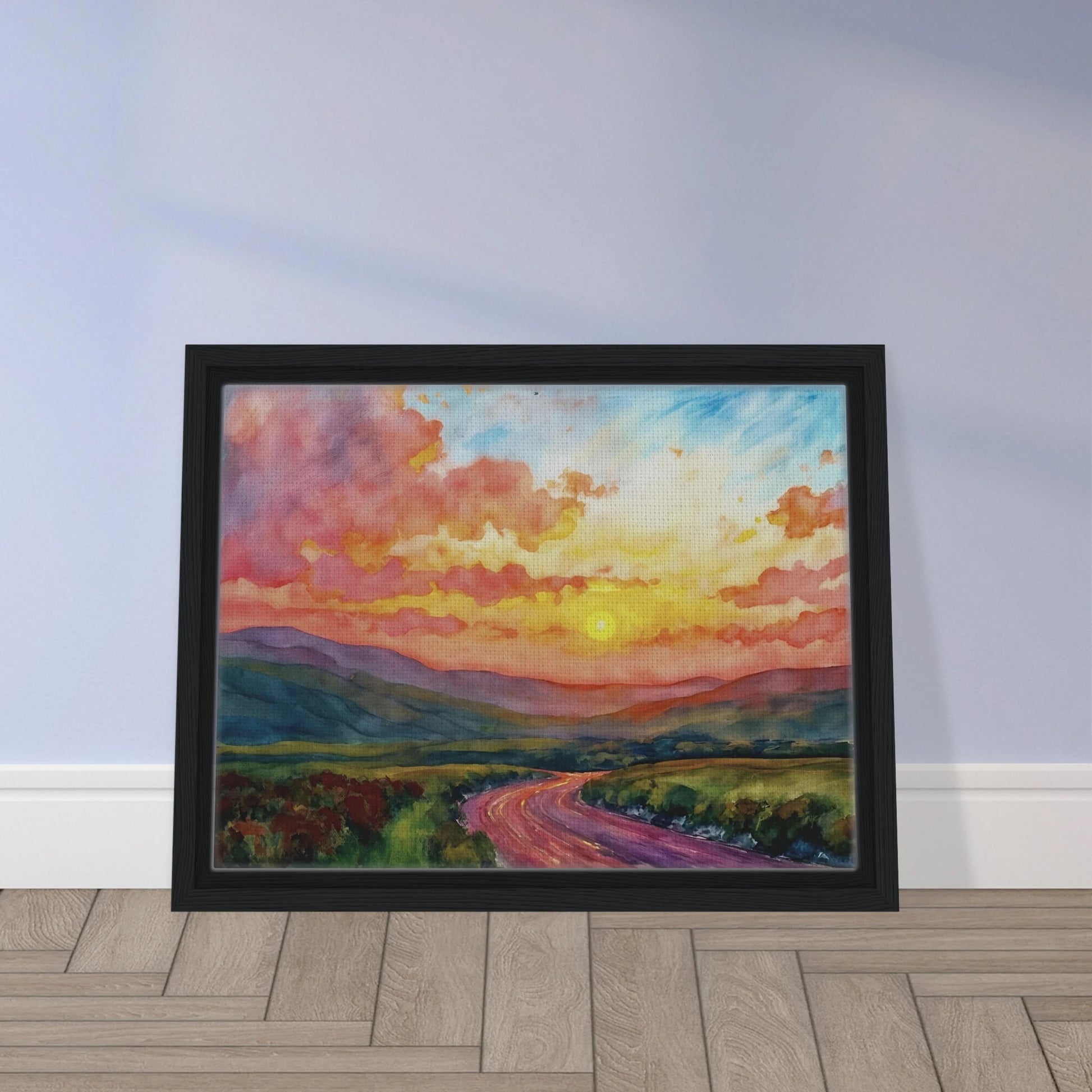 Vibrant watercolor landscape of a winding road through rolling hills beneath a glowing sunset sky filled with pink, gold, and blue clouds.