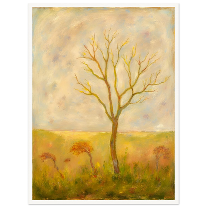 A lone tree stands tall in a golden meadow under a pale sky, its bare branches reaching gracefully toward the light.
