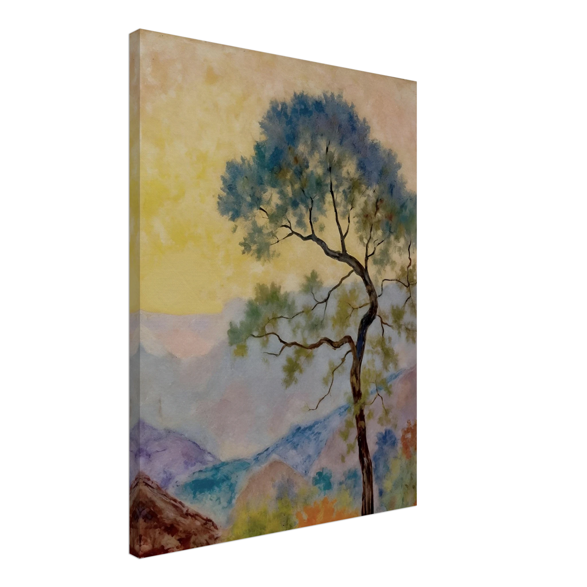Delicate tree with green-blue foliage standing before pastel mountains under a soft yellow dawn sky.