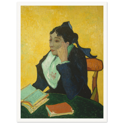 Woman in black and green sits at a table with open books against a vivid yellow background.