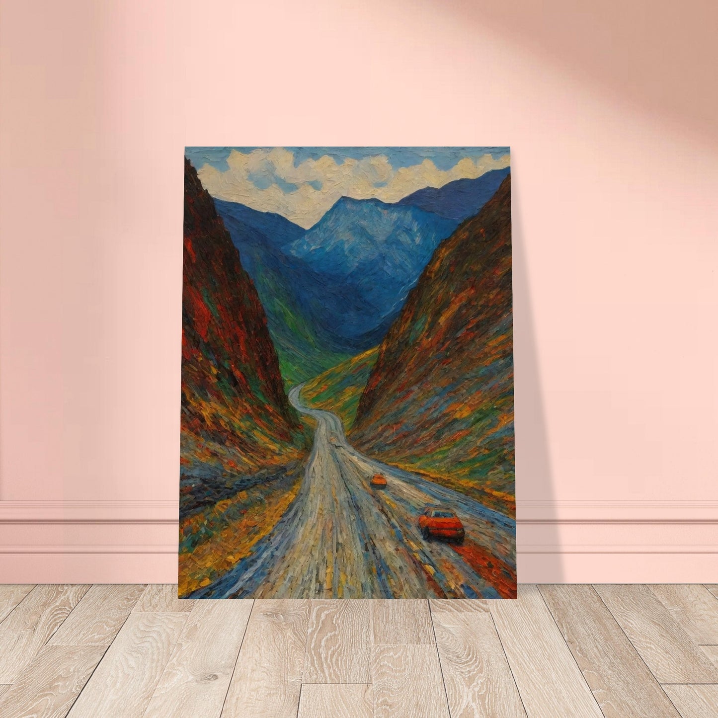 A vivid painting depicting a winding road through a colorful, mountainous landscape with two orange cars traveling along it.