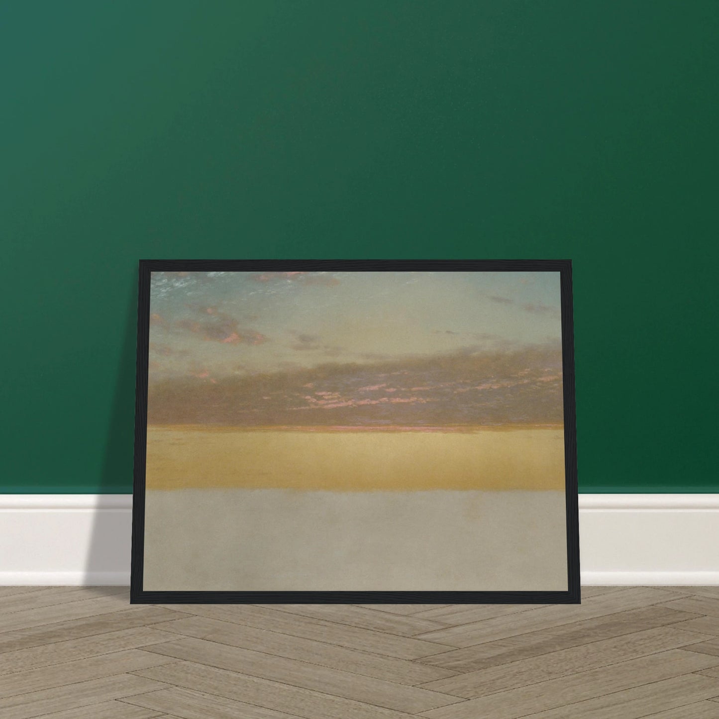 Soft sunset over calm sea with yellow horizon, blue sky, and pink clouds
