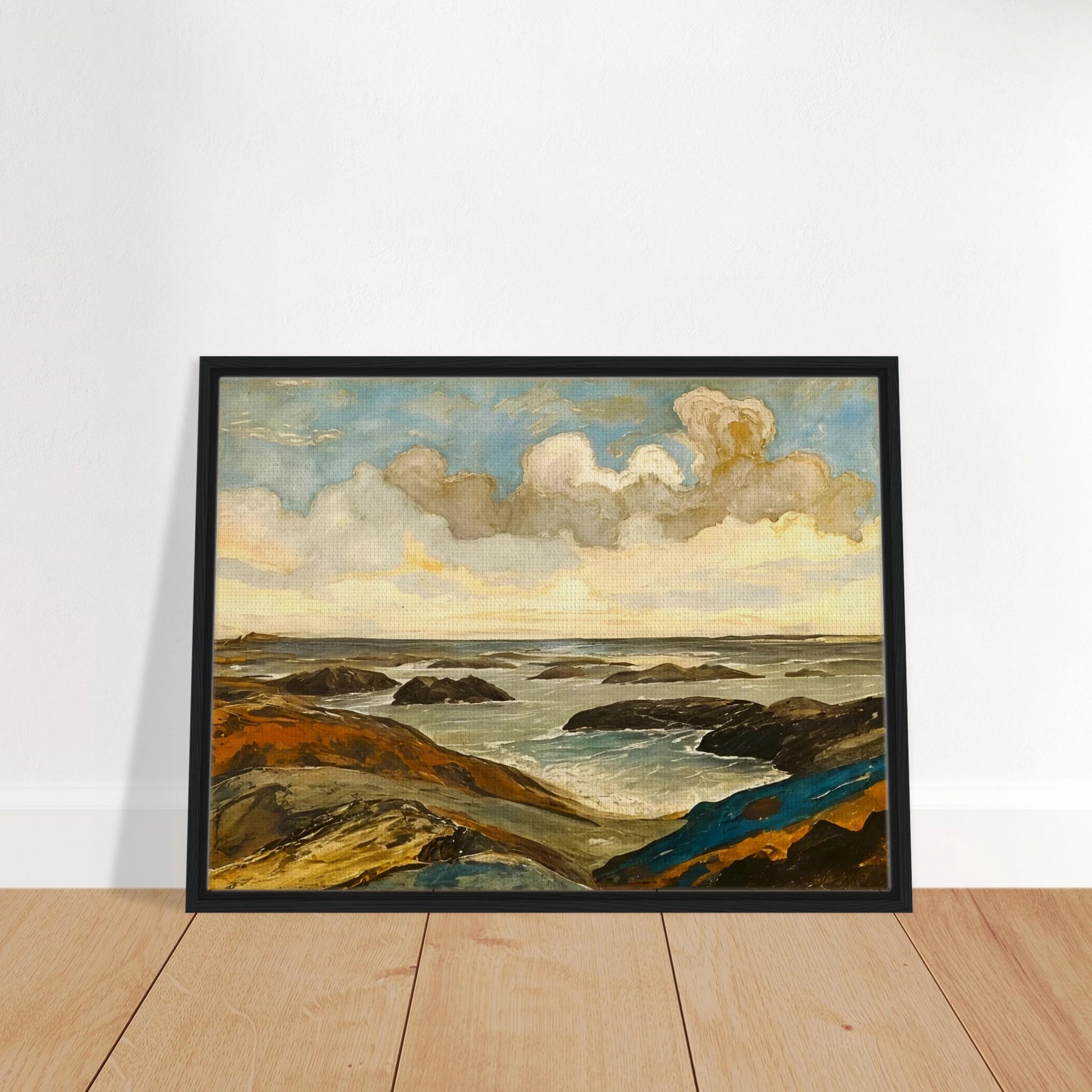 Rocky seashore with dark stones and rolling waves beneath a dramatic sky of shifting clouds and golden sunlight.