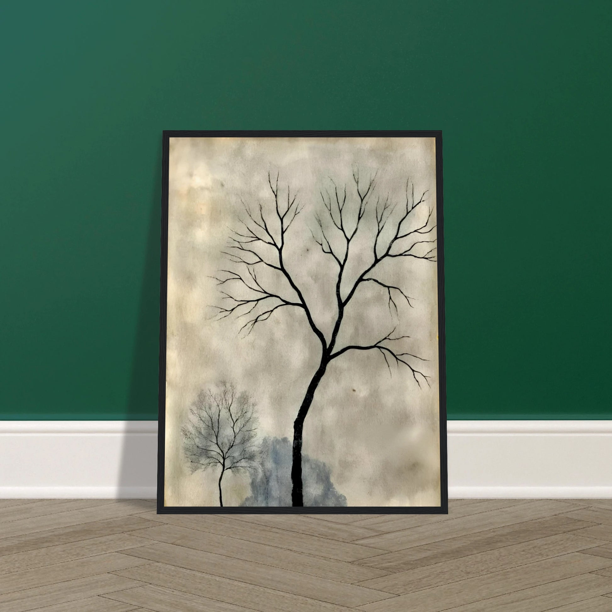 Two leafless trees stand silhouetted against a misty gray sky, evoking a quiet, contemplative atmosphere.