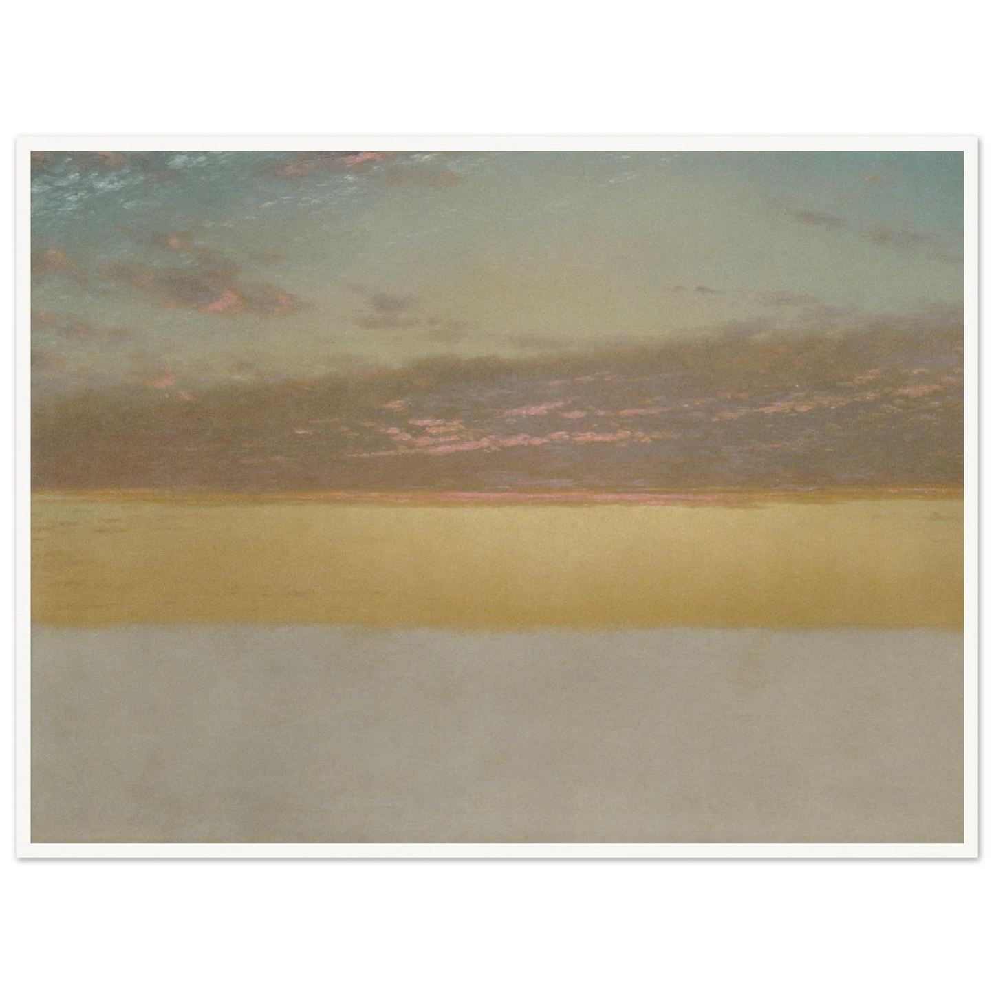 Soft sunset over calm sea with yellow horizon, blue sky, and pink clouds