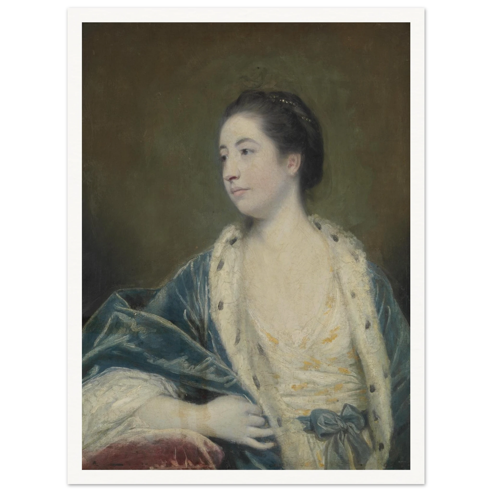 Young woman in a blue robe with fur trim poses against a dark green background